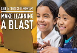 two children looking at laptop and smiling