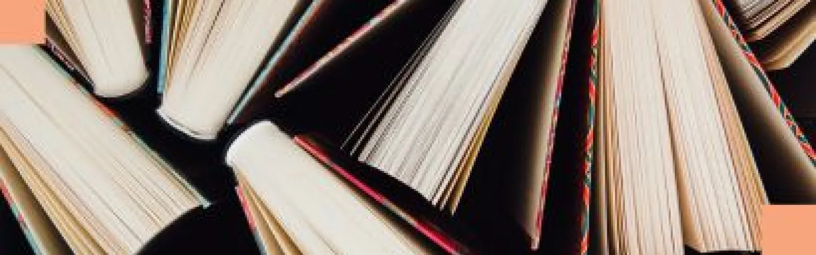 Books arranged in a pattern next to each other. 