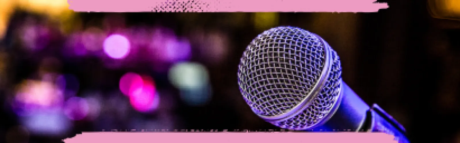 A microphone with lights in the background.