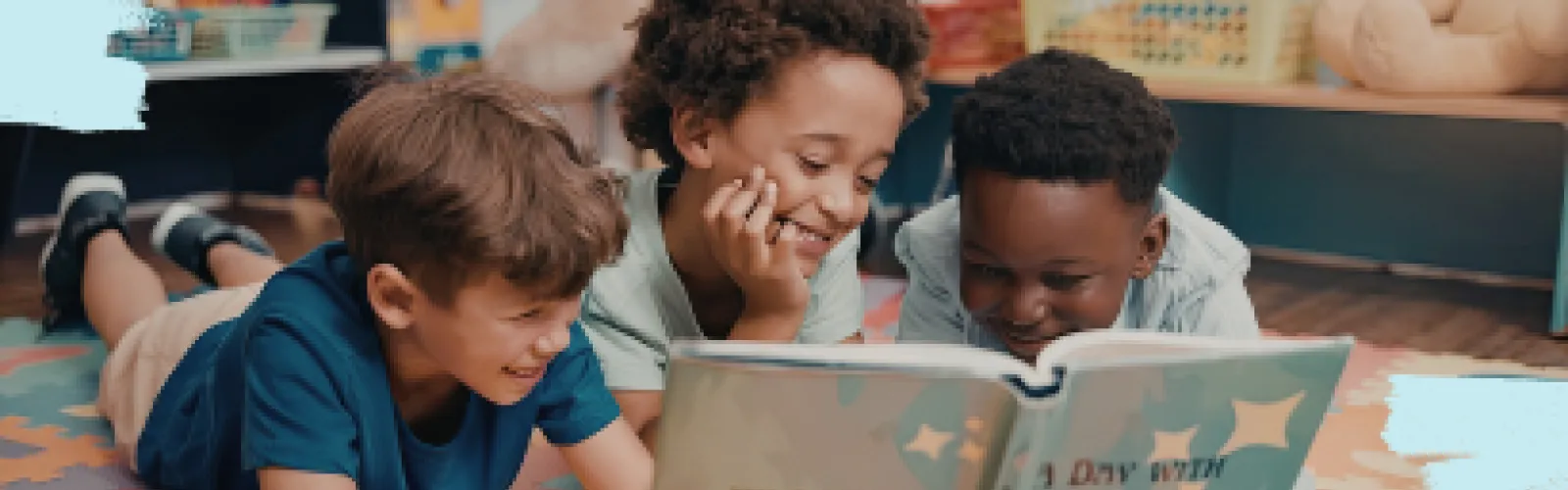 Three kids reading a book together.