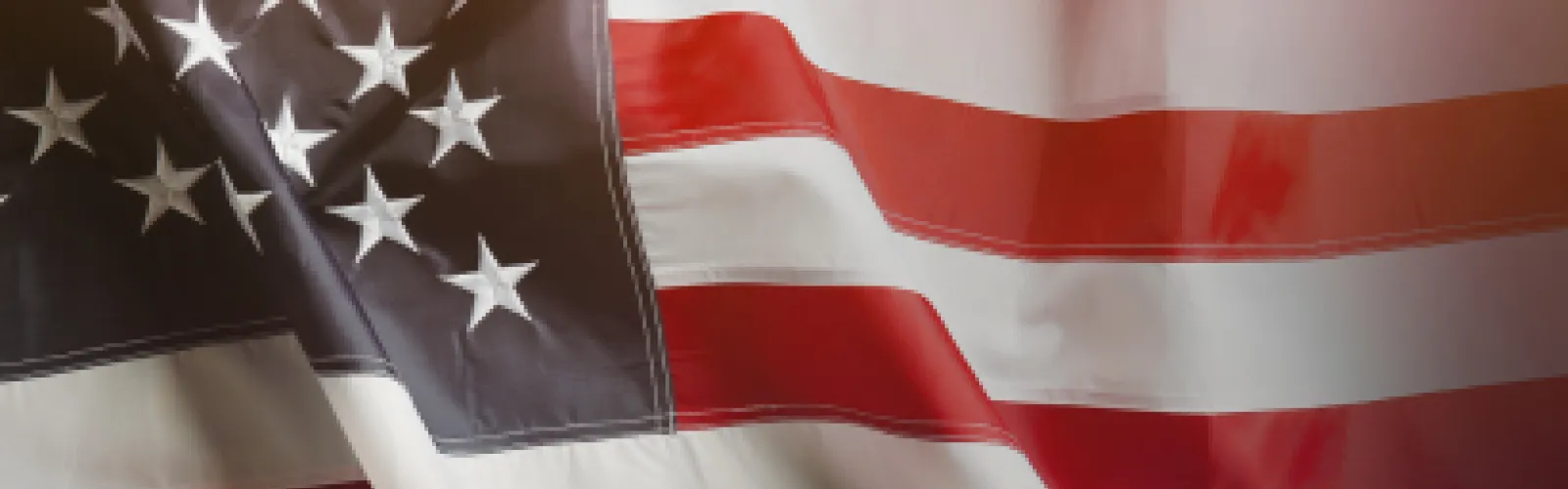 American flag blowing in the wind.